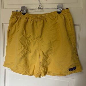Patagonia yellow swim shorts, baggies style